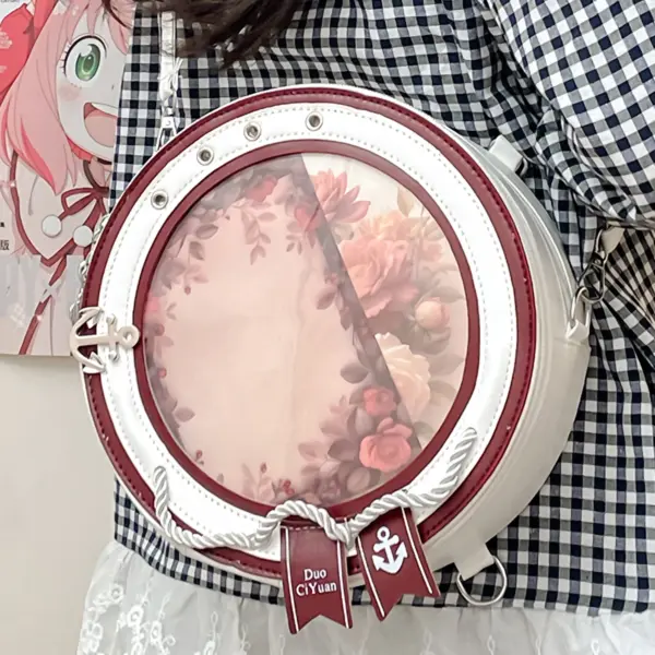 Person wearing round ita bag backpack in dark red color