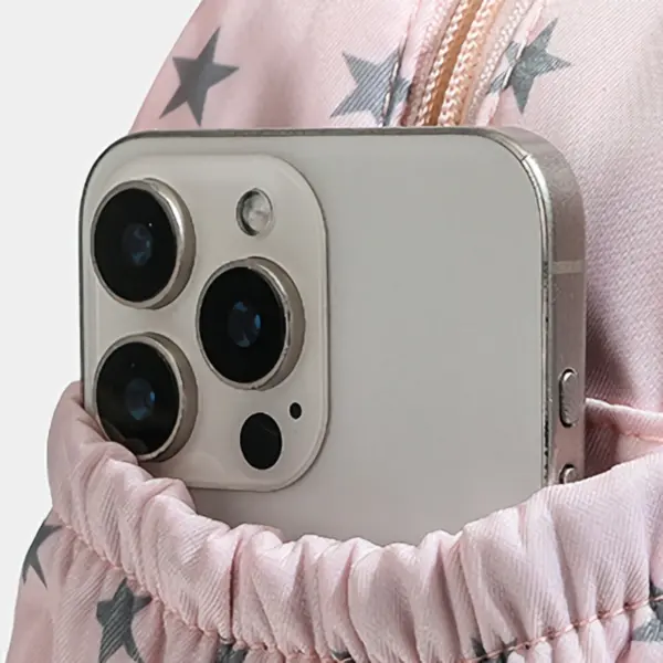 Side pocket of ita bag holding a smartphone