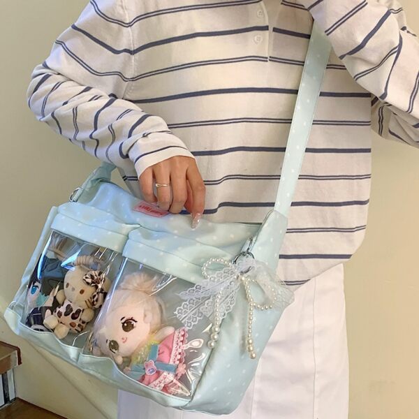 Person Wearing Sky Blue Polka Dot Ita Bag