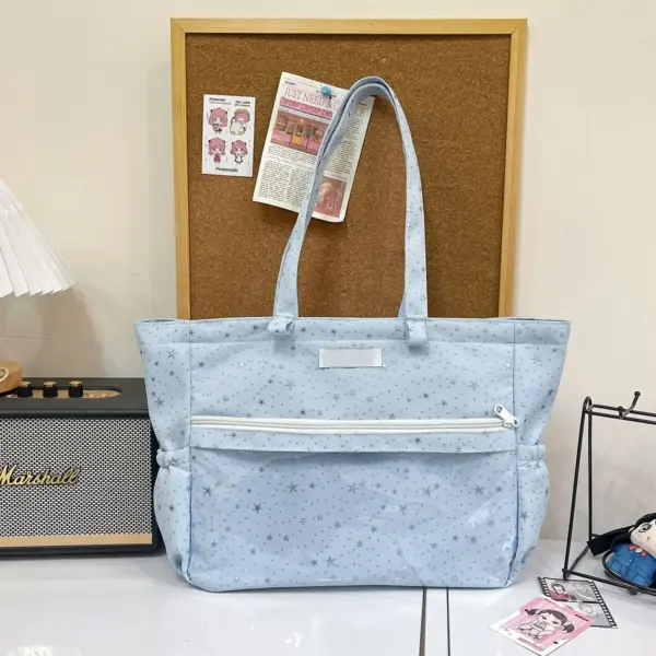 star print ita bag with plush dolls in clear window