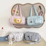 Pink and Light Blue Ita Bags on Wall