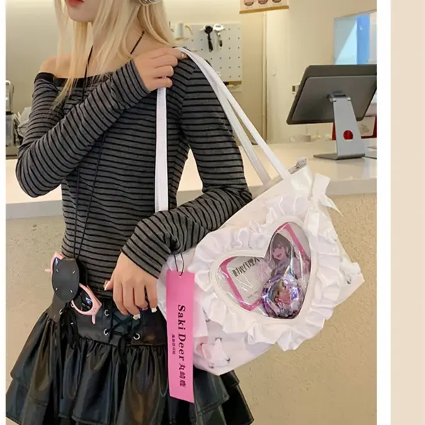 White Frilly Heart Ita Bag Held