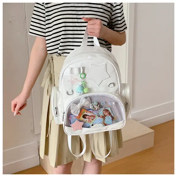 White ita backpack worn on person with clear window