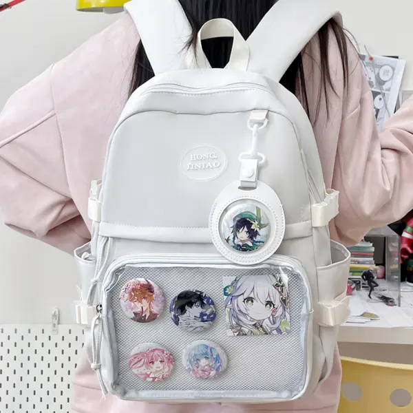 Cream ita backpack with clear window display showing pins and plushie