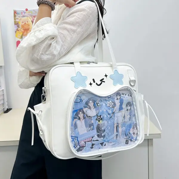White rectangular ita bag worn crossbody with blue star patches