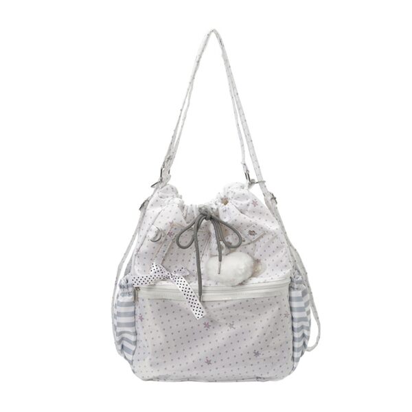 White polka dot drawstring ita bag with clear vinyl window on white background