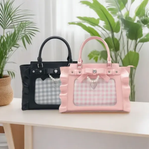 Mint green ita bag held by a person showing crossbody wear