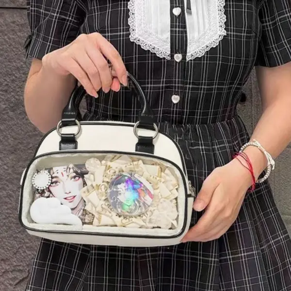 White ita bag with clear window and black handle contrast