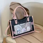 White and Black Ita Bag Resting on a Chair