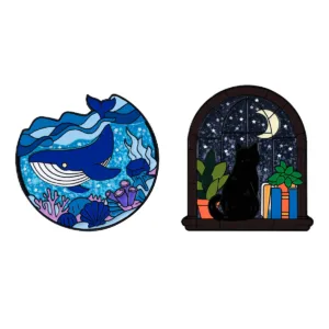 Enamel pin set with blue whale and black cat designs