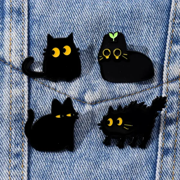 Black Cat Enamel Pins Attached to Denim Black Cat Enamel Pins Attached to Denim