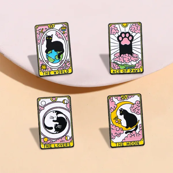 Cat Tarot Enamel Pin Collection Collection of four cat tarot enamel pins showing Ace of Paws, The Moon, The World, and The Lovers designs