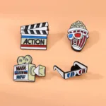 Cinema Enamel Pins on Orange Surface