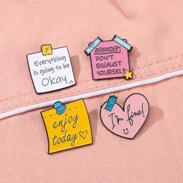 Stylized Enamel Pins on Peach Fabric