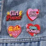 Girl Power Enamel Pins on Denim