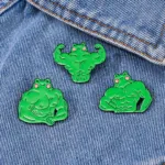 Muscle Frog Pins on Denim Fabric