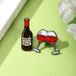 Wine Enamel Pins on Green Surface Wine Enamel Pins on Green Surface