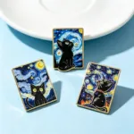 Black Cat Enamel Pins on Light Blue Surface
