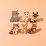 Cat Enamel Pin Set on Peach Background