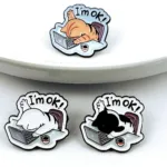Exhausted Cat Enamel Pin White Plate Display