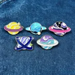 Planet Enamel Pins on Denim Fabric Planet Enamel Pins on Denim Fabric