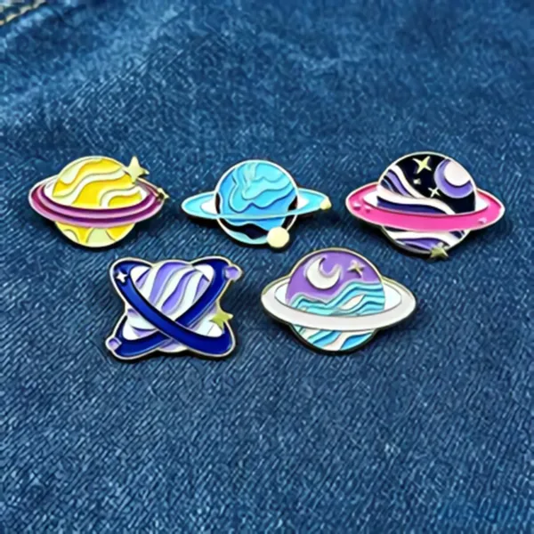 Planet Enamel Pins on Denim Fabric Planet Enamel Pins on Denim Fabric